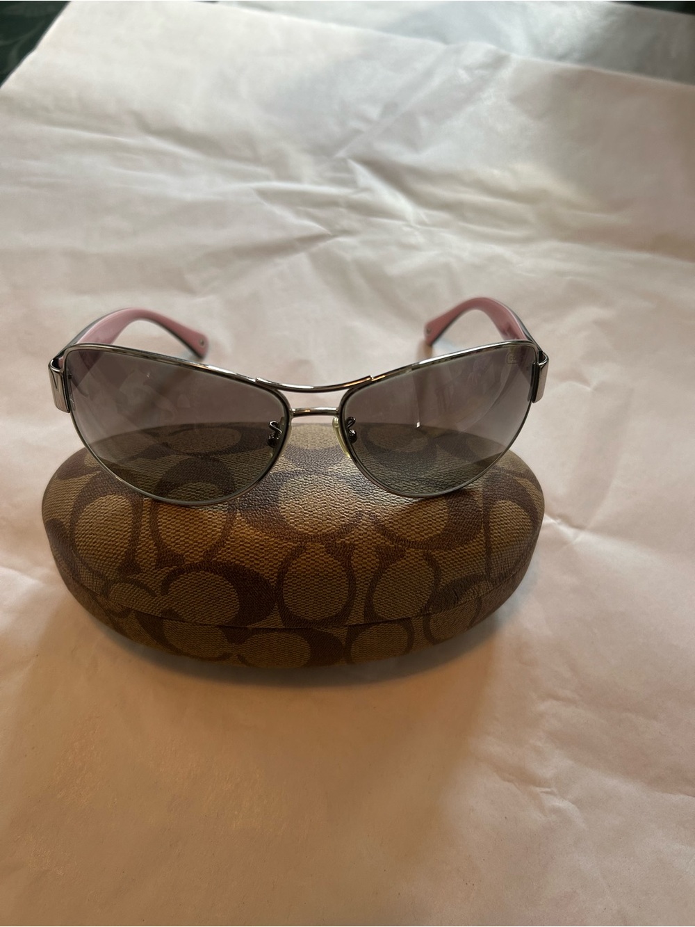 Coach HC7001 Taylor sunglasses ladies silver frame and pink temples